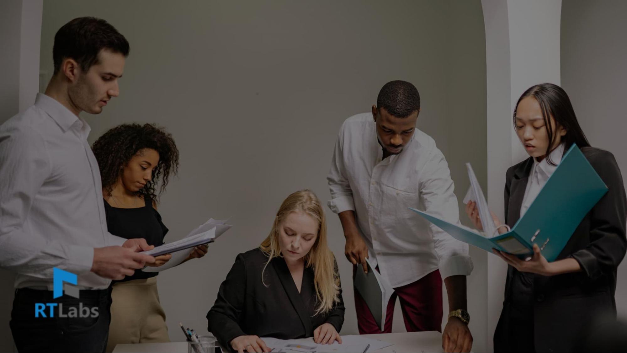 RT Labs team collaborating around documents